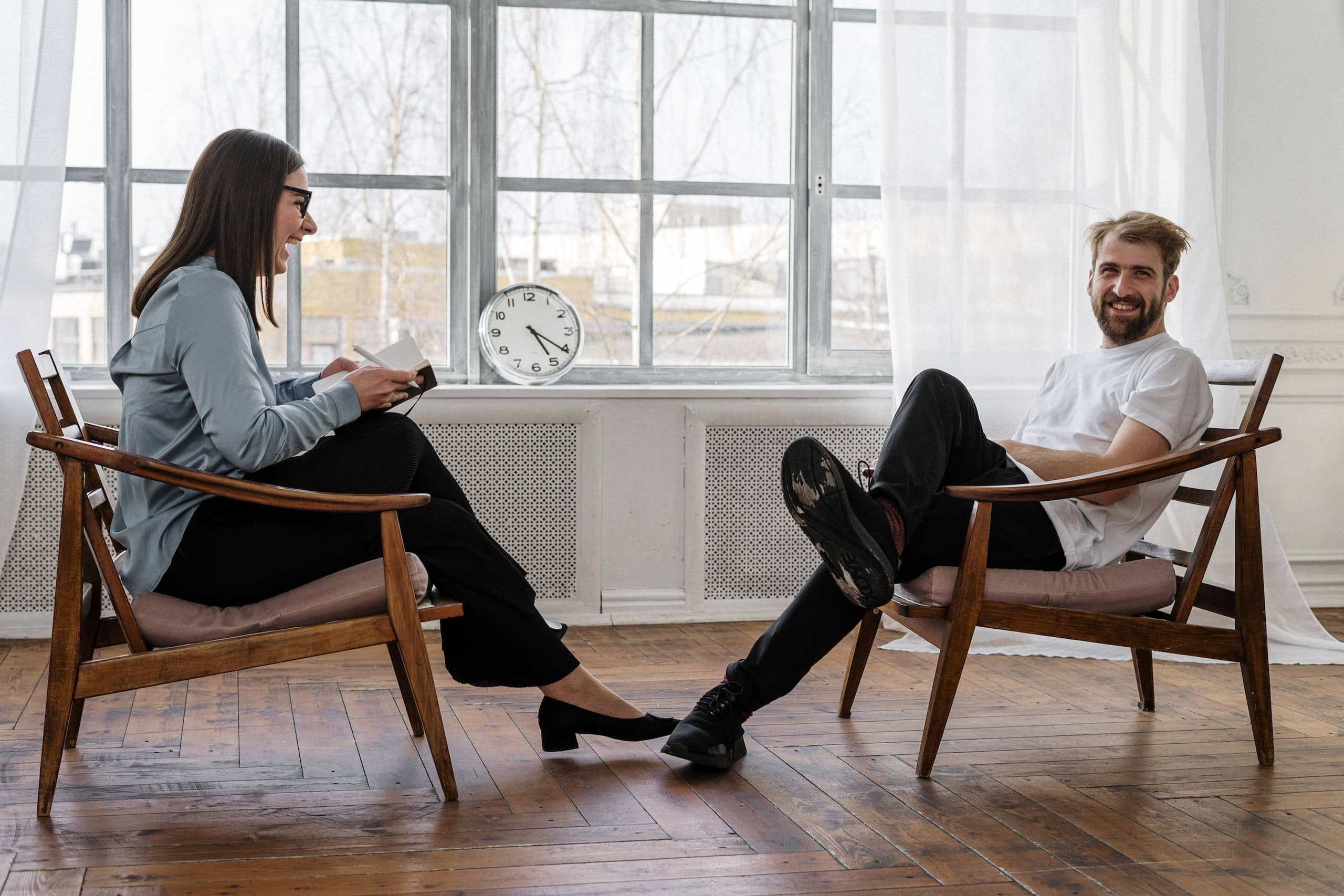 Photo by cottonbro studio 2 Women Sitting on Brown Wooden Chair